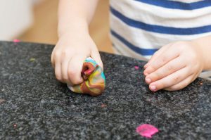 Child playing with playdoh